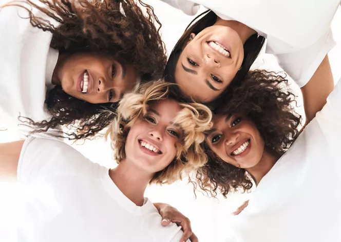 li-women-smiling-hugging